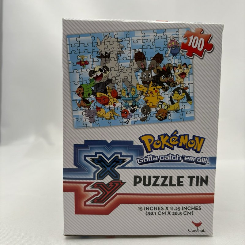 Pokemon XY Puzzle Tin Pokeball 100 Piece Cardinal Jigsaw 15x11.25 New